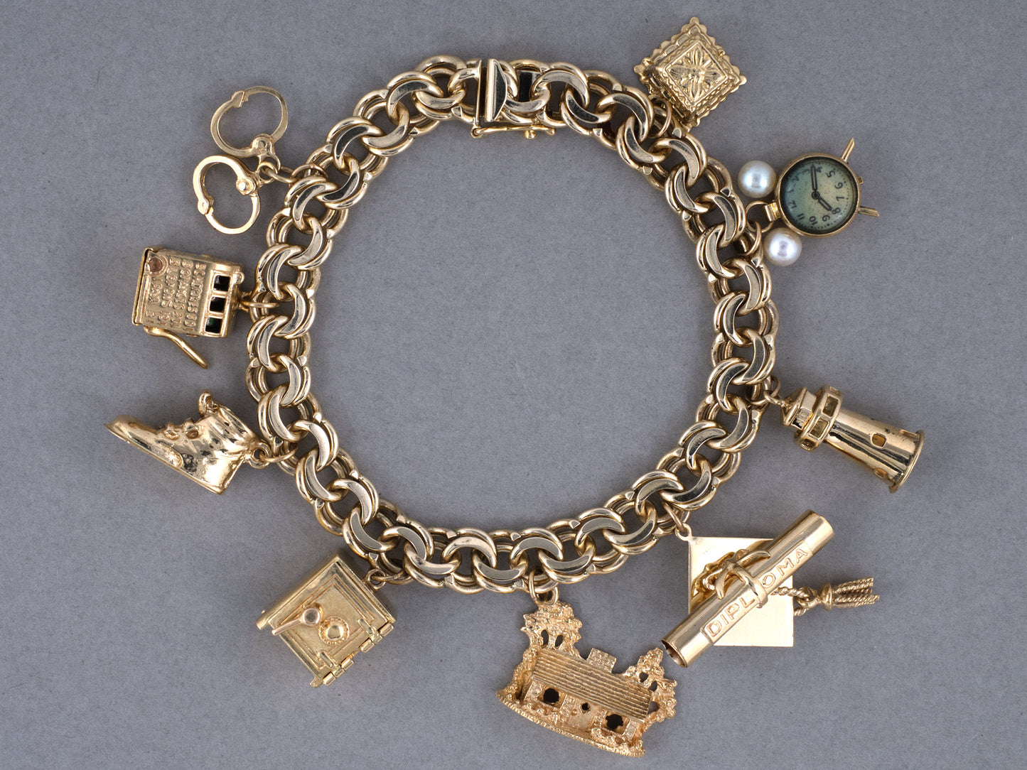 73989 - Circa 1950 Gold Double Spiral 9-Charm Bracelet