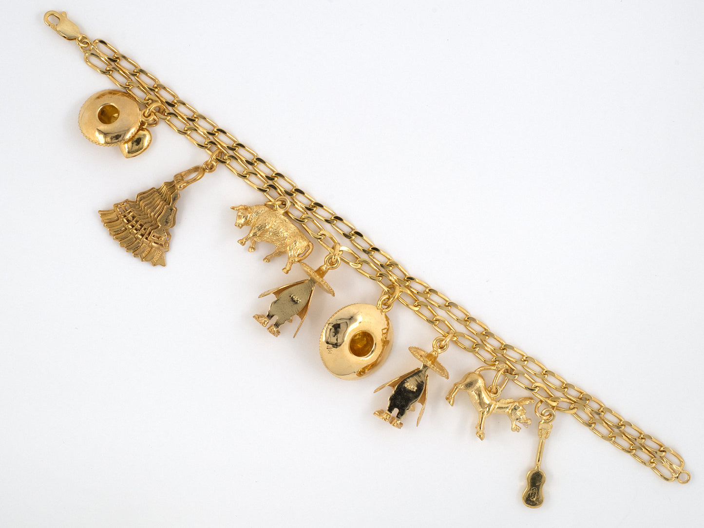 73599 - SOLD - Circa 1960s Gold Assorted Mexican Charm Bracelet