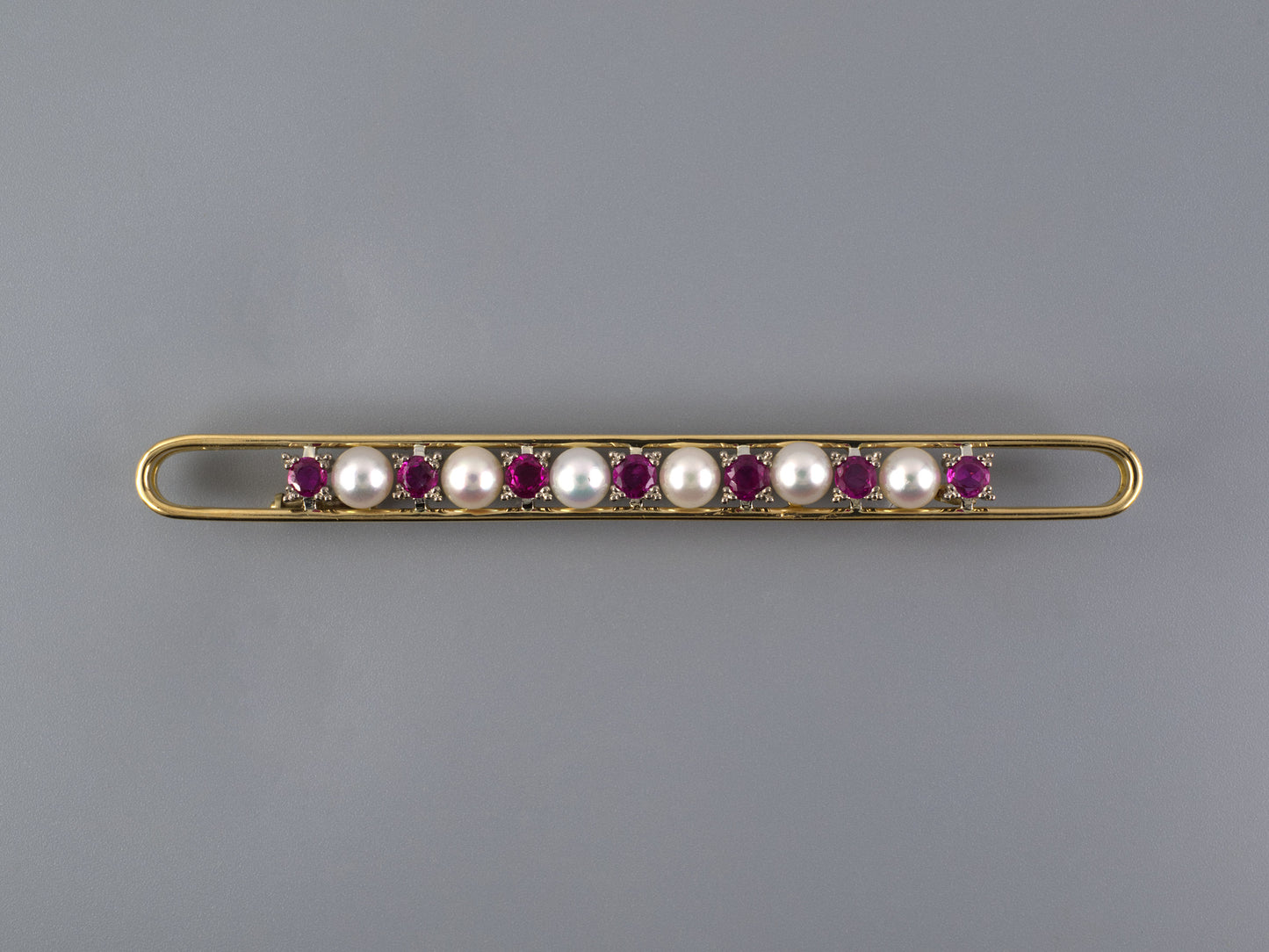 24248 - Gold Ruby Pearl Enlongated Open Bar Pin