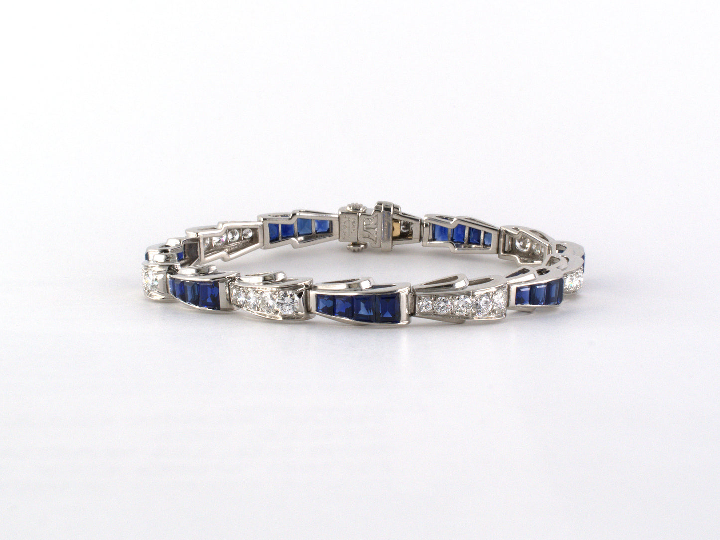 73910 - SOLD - Circa 1950 Oscar Heyman Platinum Diamond Calibre Sapphire Wave Line Bracelet