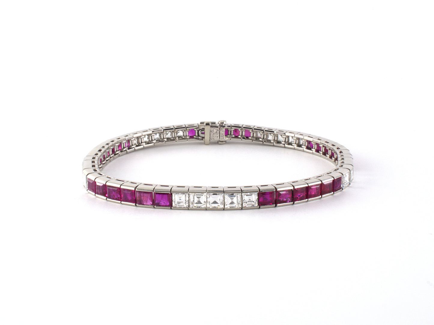73933 - Circa 1950 Waslikoff Platinum Diamond Ruby Tapered Straight Line Bracelet
