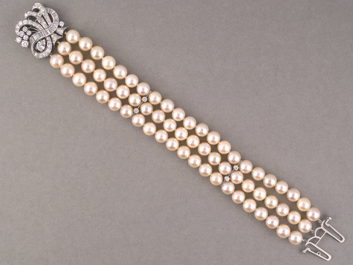 73938 - Circa 1960s Platinum Diamond Akoya Pearl 3-Row Swirl Ribbon Bracelet