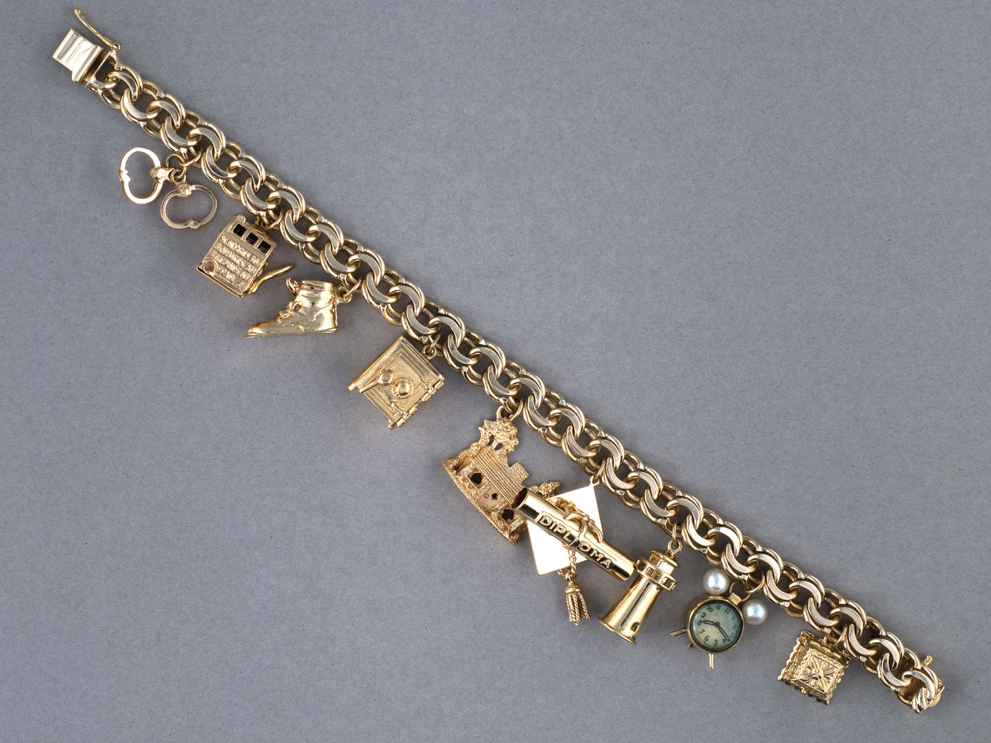 73989 - Circa 1950 Gold Double Spiral 9-Charm Bracelet