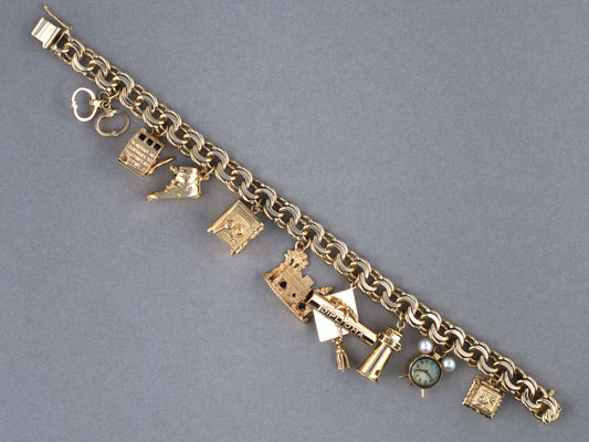 73989 - Circa 1950 Gold Double Spiral 9-Charm Bracelet