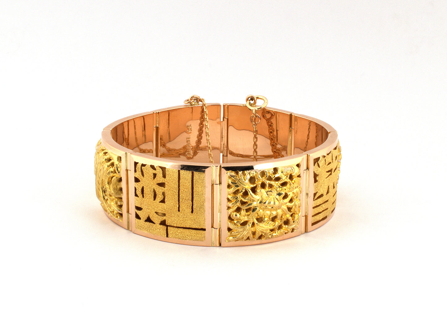 74007 - Circa 1950s Gold Carved Chinese Design Hinged Panel Wisdom/Happiness Wealth Longevity Health Bracelet