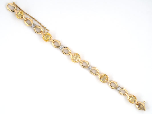 74015 - Retro Maurice Tishman Gold Palladium Diamond Yellow Sapphire Bow Bracelet