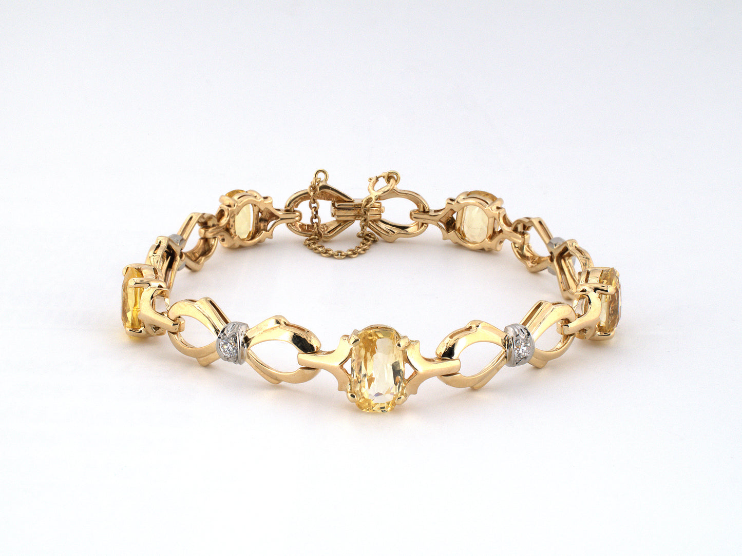 74015 - Retro Maurice Tishman Gold Palladium Diamond Yellow Sapphire Bow Bracelet