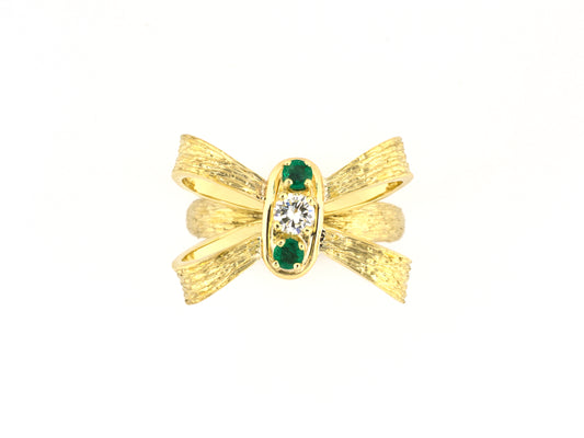 902353 - Circa 1960s Gold Emerald Diamond Carved Bow 3-Stone Ring