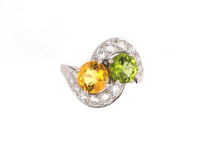 92481 - Circa 1950s Platinum Diamond Yellow Beryl Peridot By Pass 2-Stone Ring