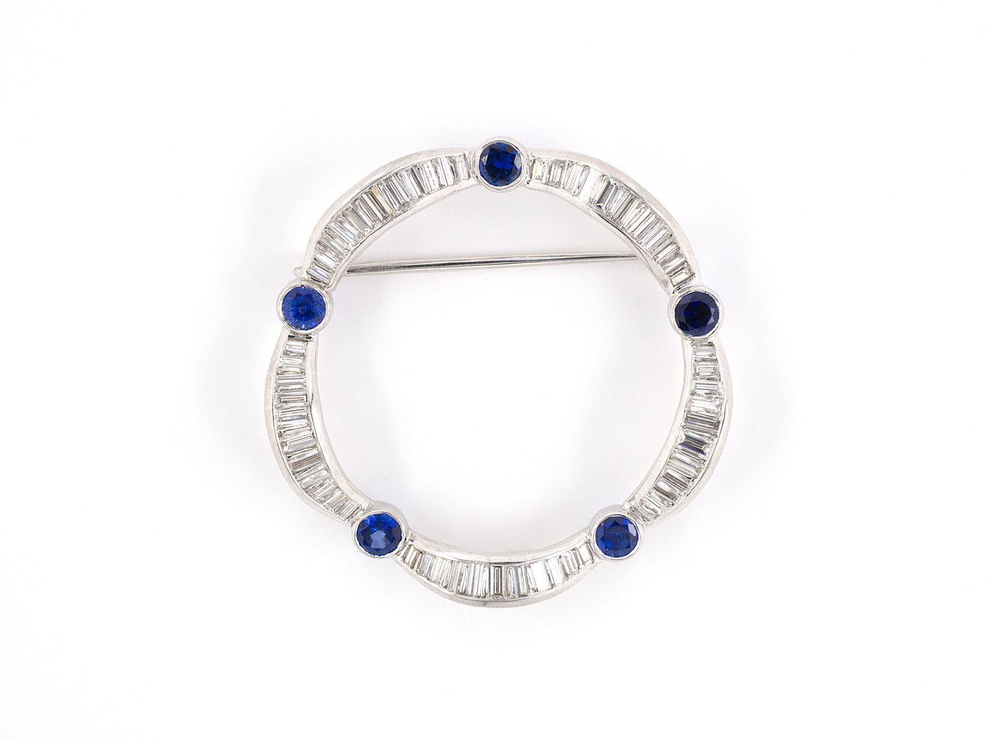 21560 - SOLD - Circa 1950s Platinum Diamond Sapphire Circle Pin