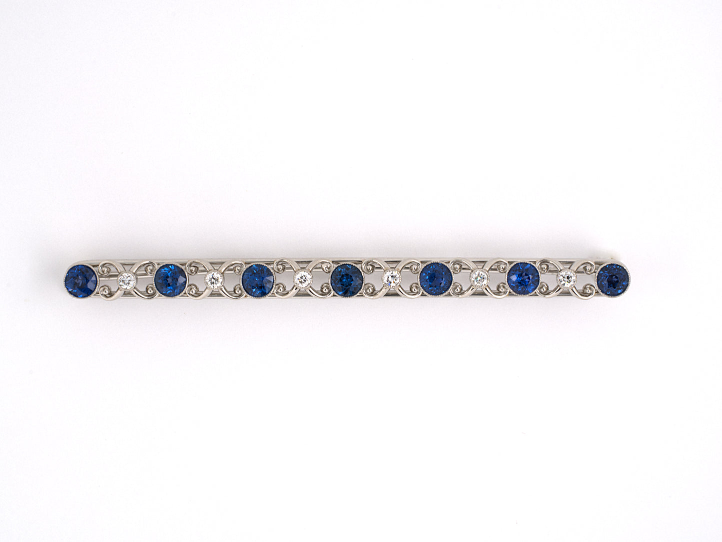 21828 - Edwardian Cresarrow Platinum Sapphire Diamond Bar Pin