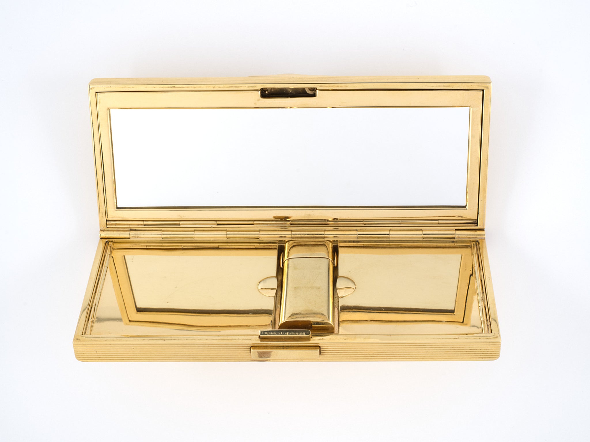 A GOLD AND RUBY LIPSTICK HOLDER, BY CARTIER