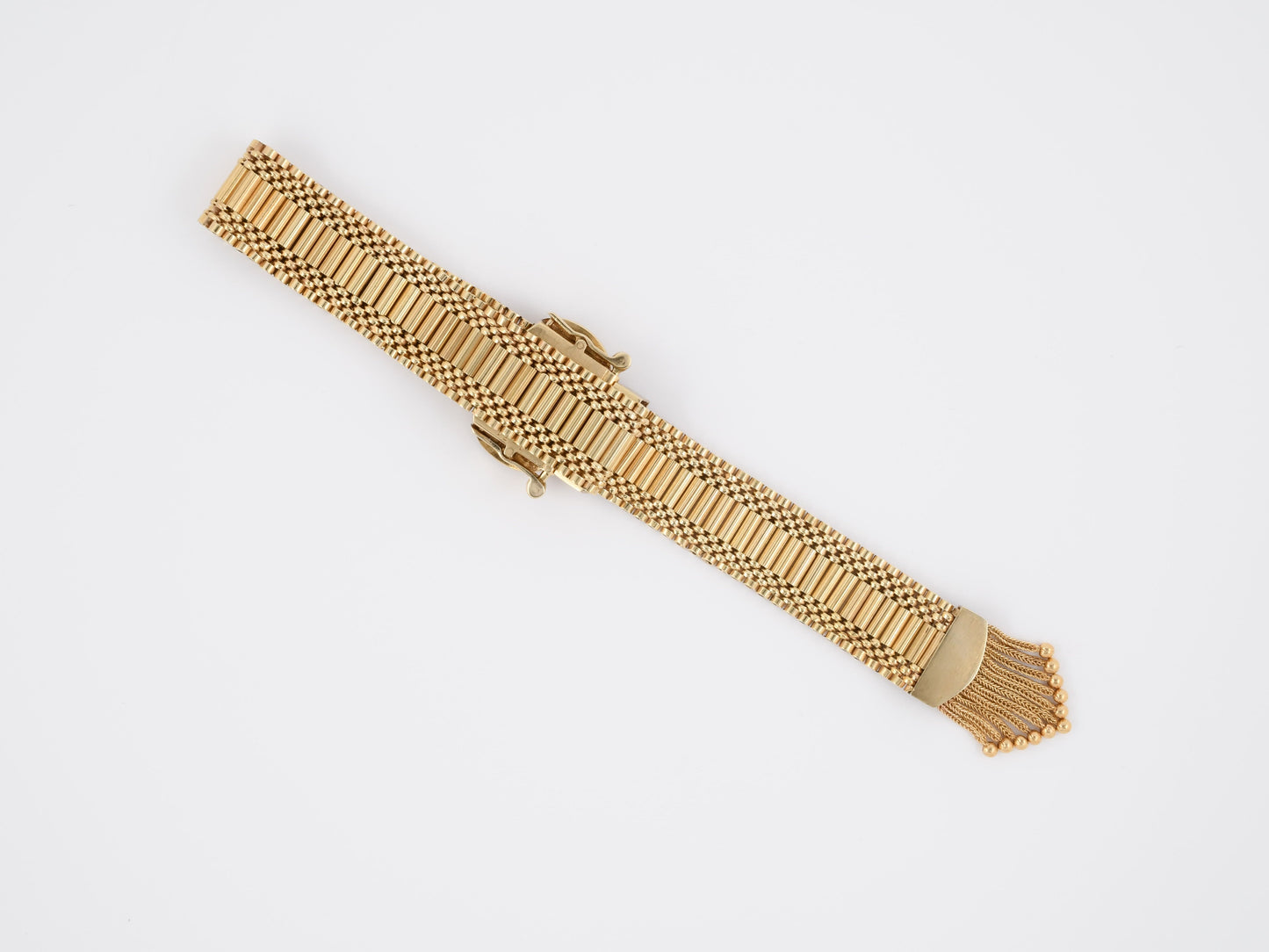 72439 - Circa 1955 Gold Enamel Buckle Tassel Bracelet