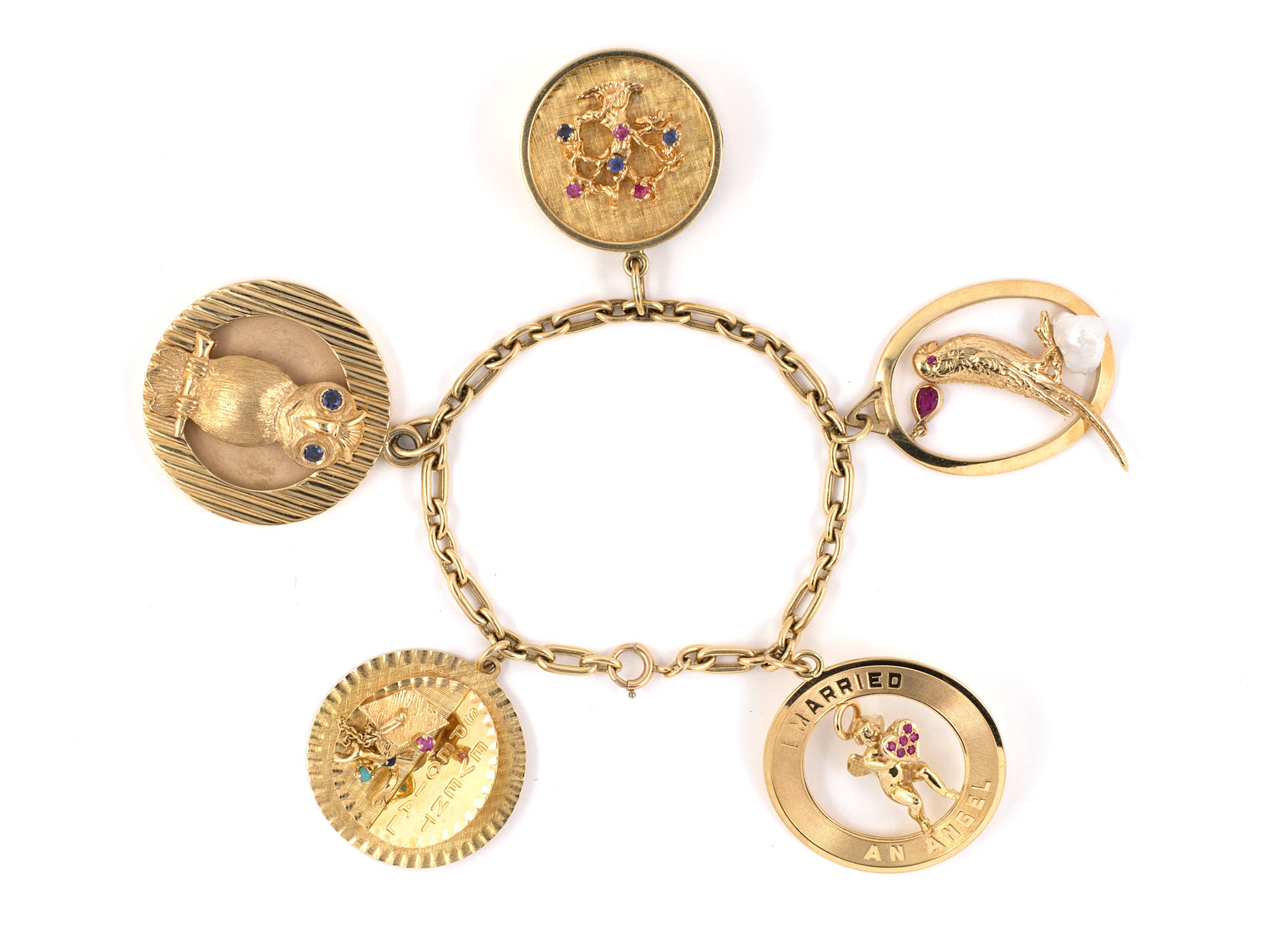 Past auction: 14 karat yellow gold international charm bracelet 1950s |  December 6, 2008