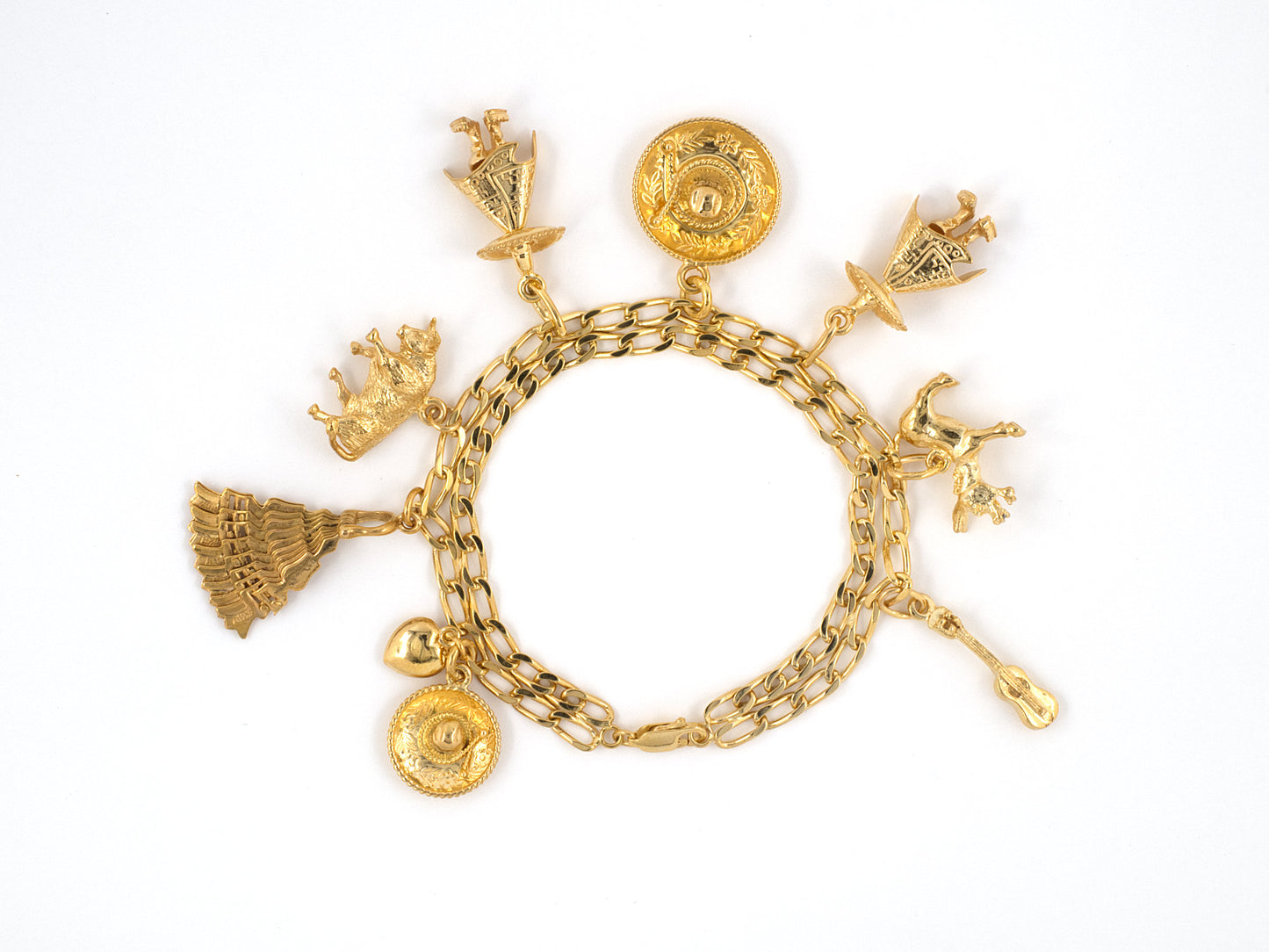73599 - SOLD - Circa 1960s Gold Assorted Mexican Charm Bracelet