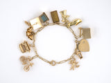 73627 - SOLD - Circa 1950 Gold Diamond Wire Link 12 Assorted Charm Bracelet