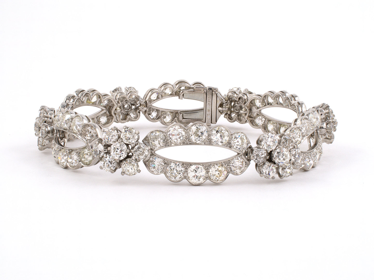 73682 - Circa 1950 Platinum Diamond 6 Section Woven Floral Cluster Bracelet