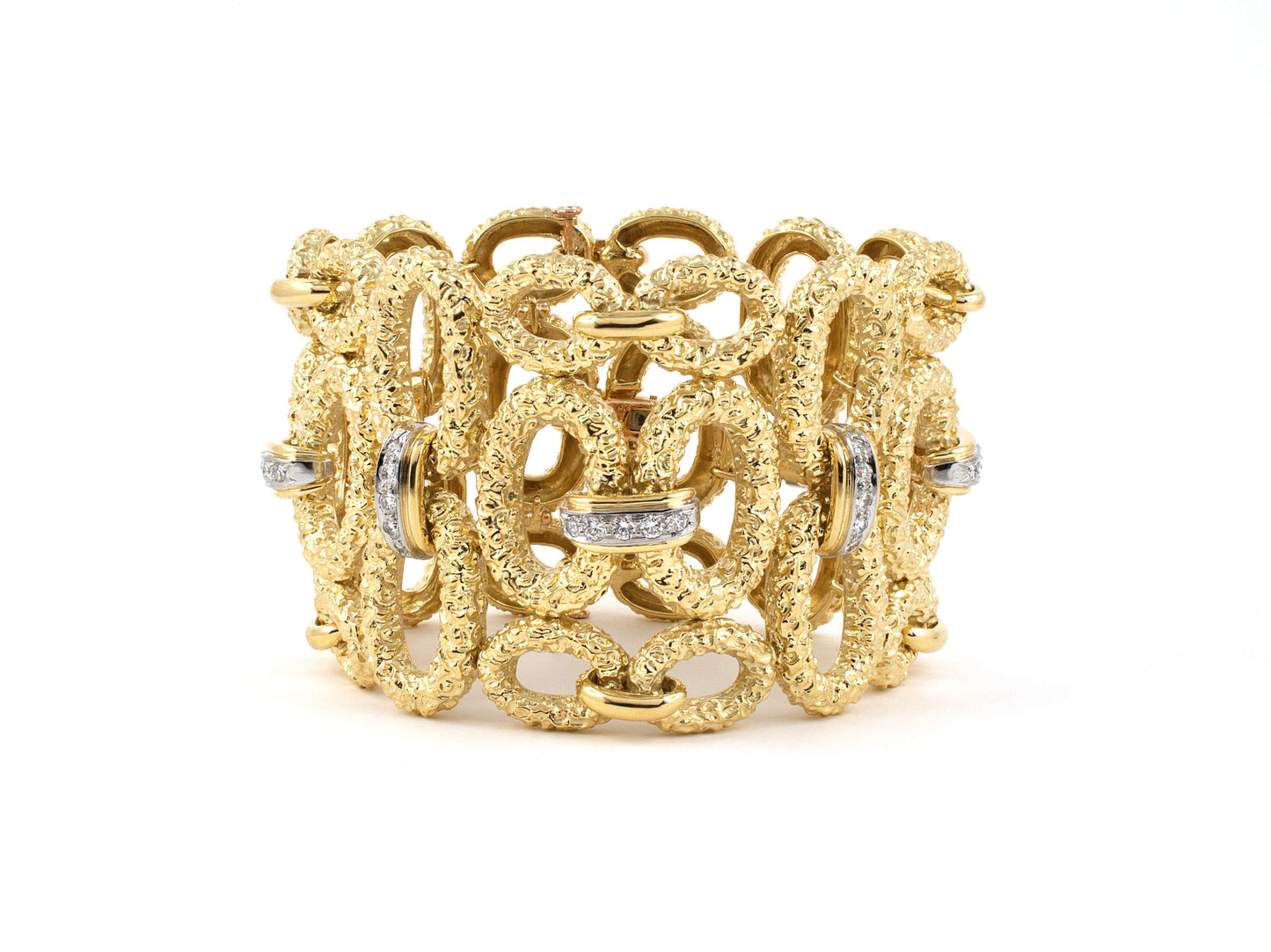 73746 - Circa 1965 French Platinum Gold Diamond Open Oval Link Textured Bracelet