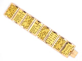 73800 - Circa 1950s Gold Carved Chinese Design Hinged Panel Wisdom/Happiness Wealth Longevity Health Bracelet