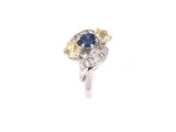 90829 - Circa 1950s Gold Diamond Blue Sapphire Yellow Sapphire 3-Stone Twist Ring